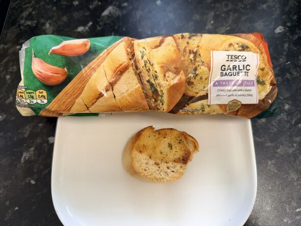 Tesco garlic baguette packet with slice on kitchen counter