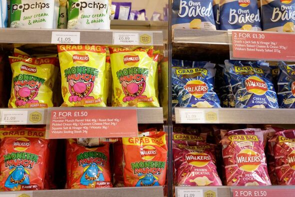 A price deal is seen advertising advertising packets of crisps in a shop in Birmingham, United Kingdom