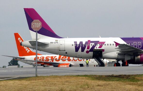 Low-cost carriers Wizz Air and Easyjet airplanes prepare for