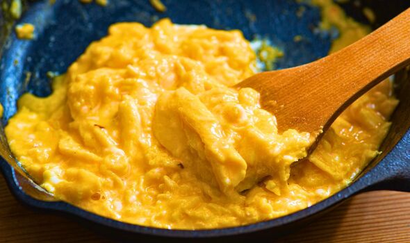 Picture of soft scrambled eggs cooking in a pan