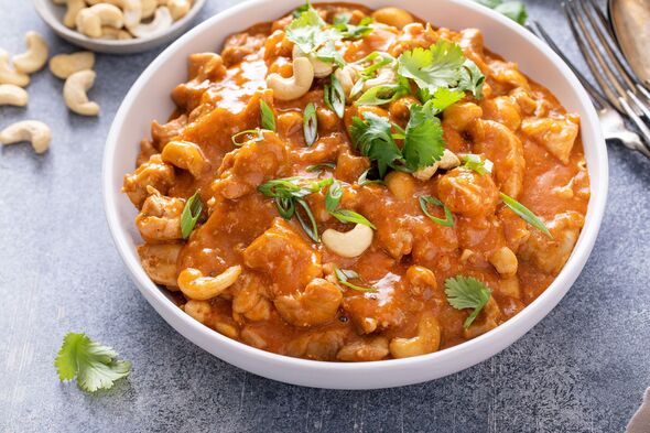 Chicken curry or butter chicken with cashew nuts and cilantro