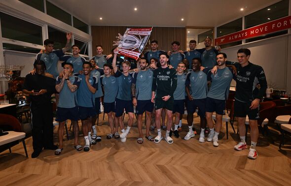 Arsenal players celebrate winning the Premier League title