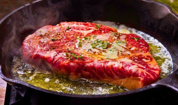 Picture of someone cooking steak