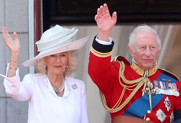 Camilla and Charles wave at trooping the colour
