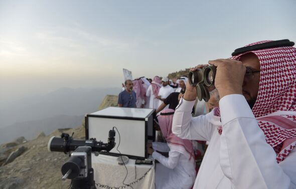 Saudi officials observe the sky