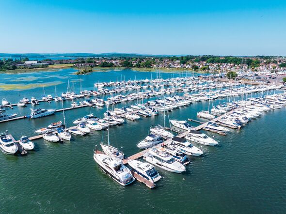 Boats docked at poole harbour on a sunny day in dorset, england