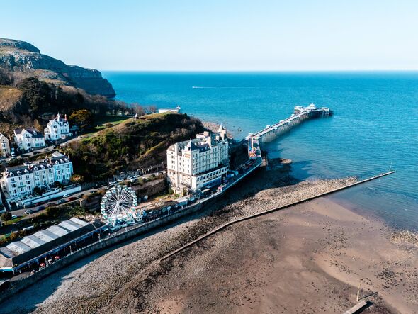 View of Llandudno pier in the centre of Llandudno UK.