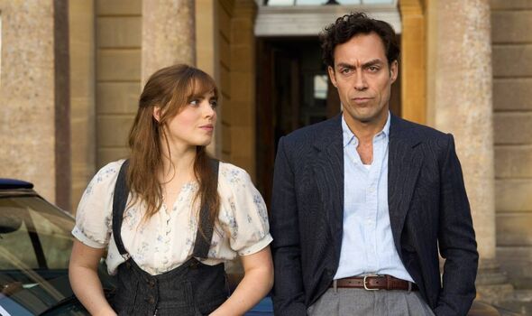 A brunette woman and a clean shaven man in a suit.