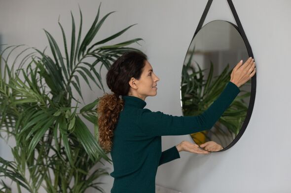 Caucasian woman decorate own home moving in