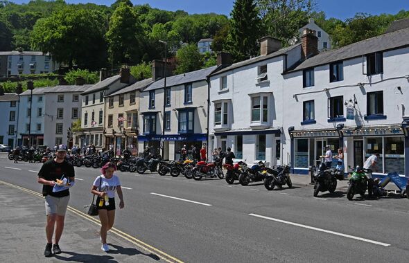 People eat fish and chips in Matlock Bath