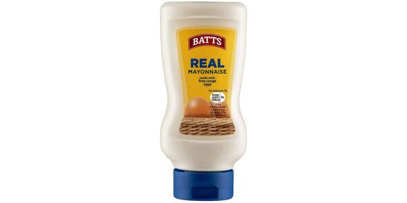 A bottle of Lidl Batts Real Mayonnaise standing on its lid on a white background