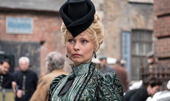 A woman wears 1800s clothing