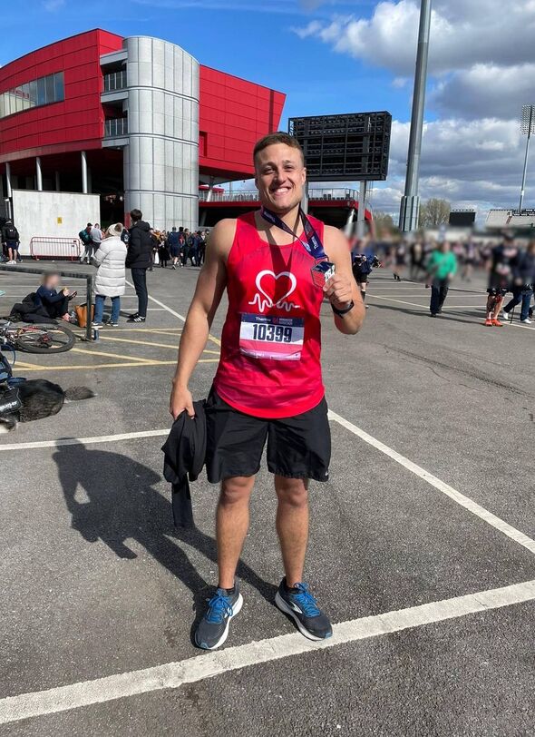 Ryan Mickleburgh with a running medal