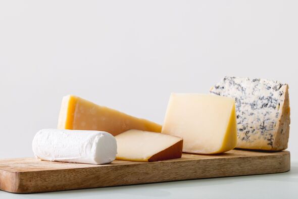 Close-up of cheese on white background