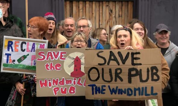 Brits protesting outside a pub