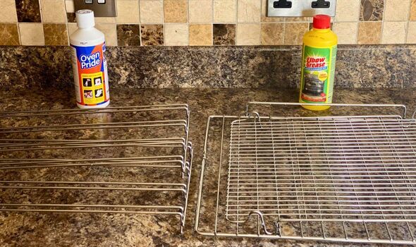 A close-up view of a kitchen countertop adorned with granite tiles. On the left, a bottle of cleaning solution is positioned, wh
