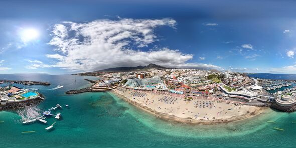 360 aerial photo taken with drone of Playa de la Pinta in Costa Adeje, Tenerife, Spain