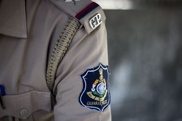 Indian gujarat policeman deployed on event duty to handle crowd security in uniform on road safety