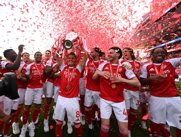 Arsenal lifting the Premier League trophy on the final day of the season.