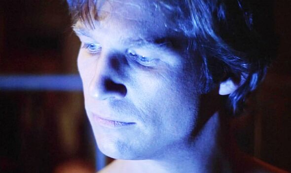 Close-up of a man with face bathed in blue light