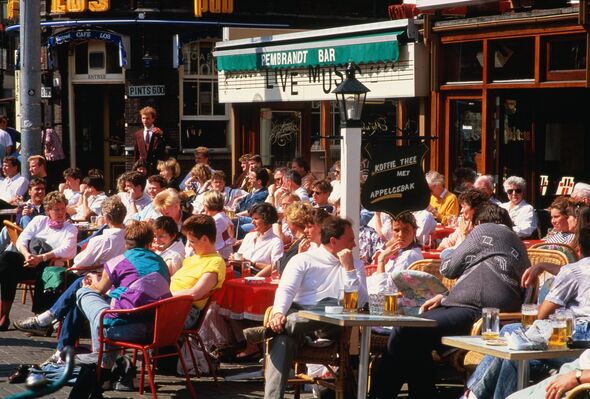 Holland,Amsterdam,Rembrandtsplein, people at outdoor cafe tables