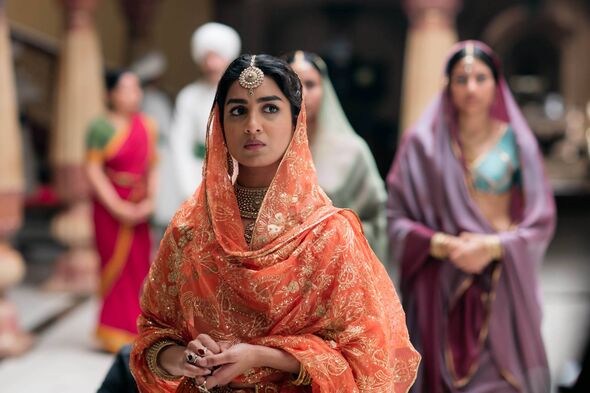A woman wearing a red sari in Beecham House