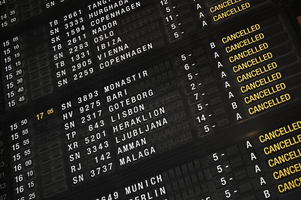 Information board indicating cancelled flights at Brussels airport