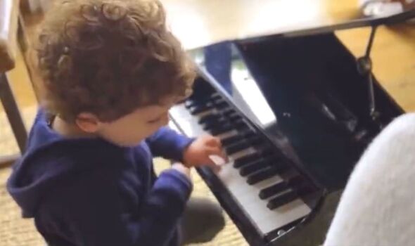 Prince Archie plays a keyboard