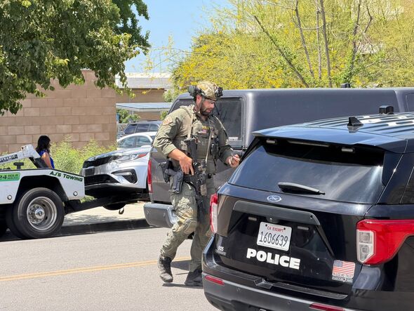 A man is currently held up inside the Chase Bank. Armed police are at the scene