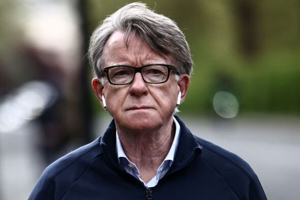 Former UK Ambassador to the US, Peter Mandelson, pictured while walking his dog