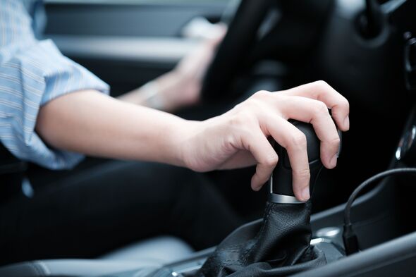 Close-up of woman's hands while driving