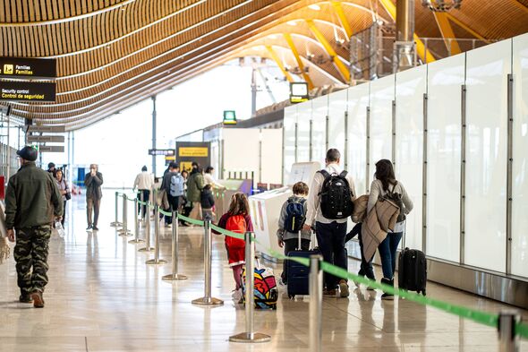 Travelers at Adolfo Suarez Madrid-Barajas Airport