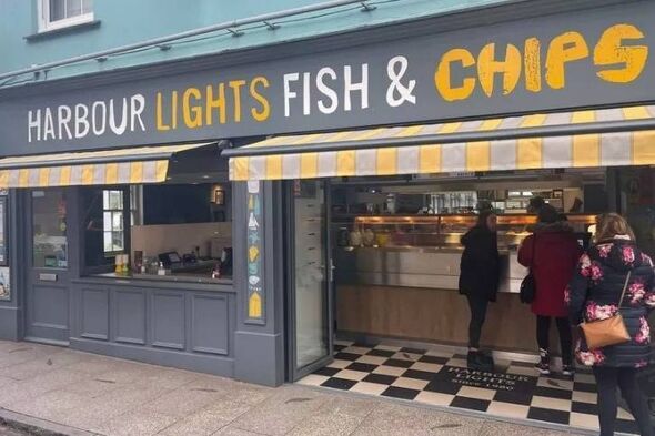 Exterior of a seafood restaurant with a sign that reads