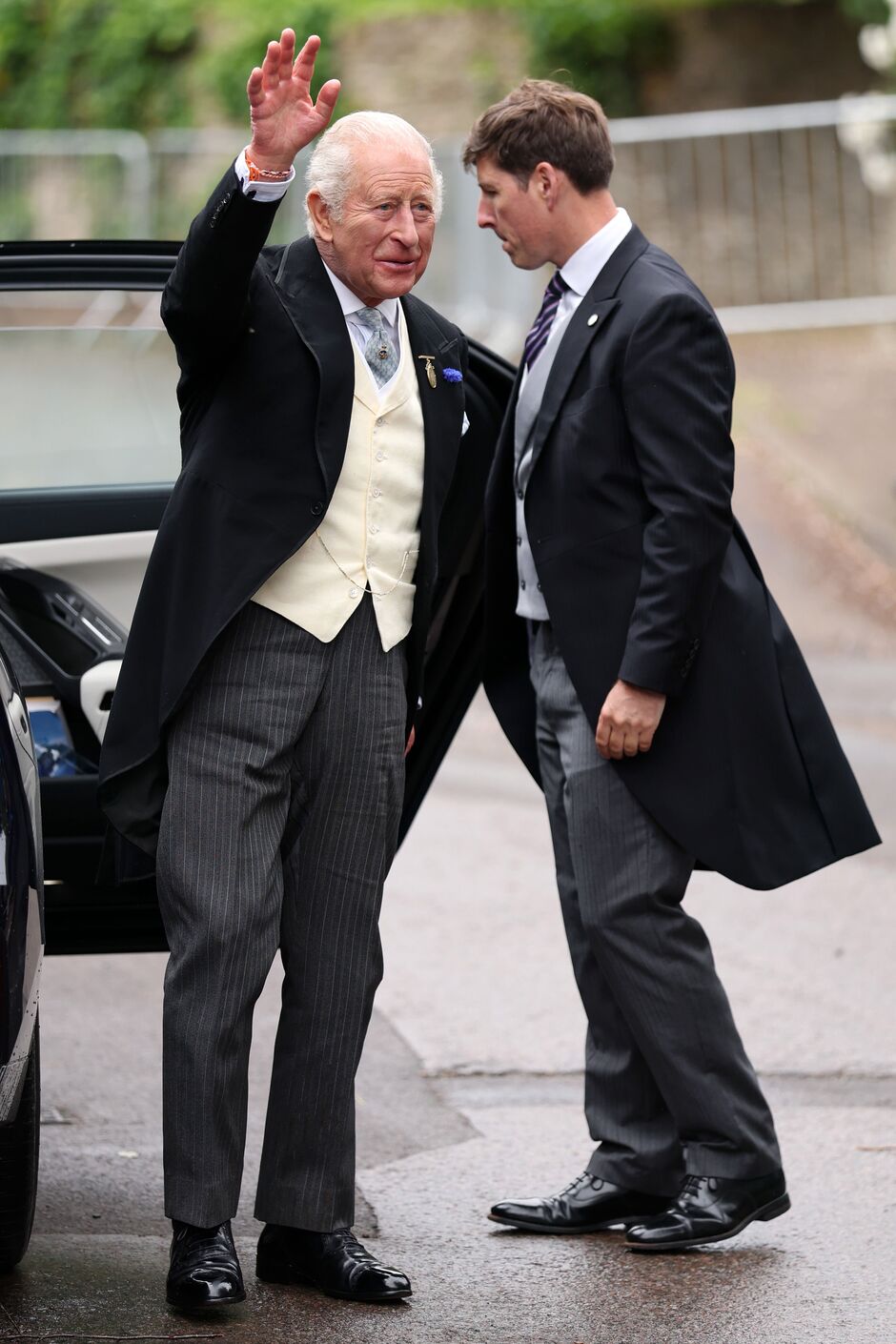 King Charles waving at onlookers
