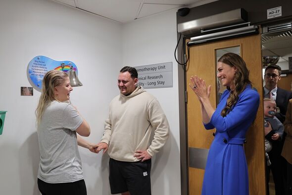 Claire Lorente rings the bells to signal the end of her treatment