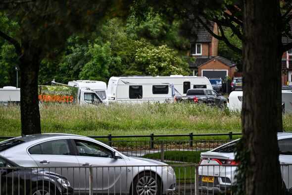 Group of travellers set up illegal camp of 40 caravans on parkland