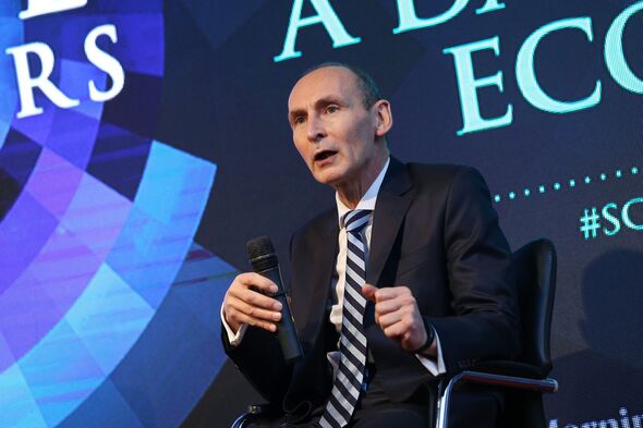Nigel Green speaks seated with microphone