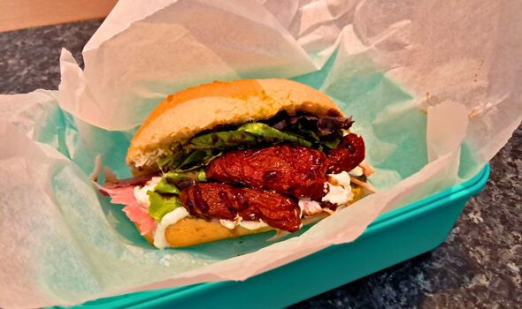 Picture of a sandwich wrapped in baking paper