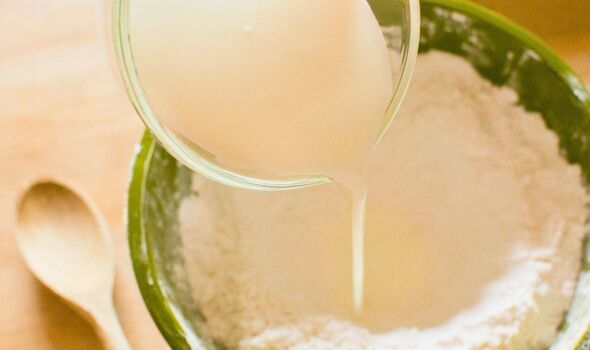 Picture of someone adding buttermilk to a bowl