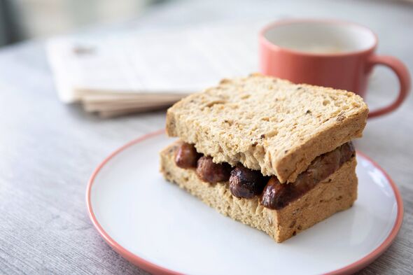 Breakfast sausage sandwich with pink crockery