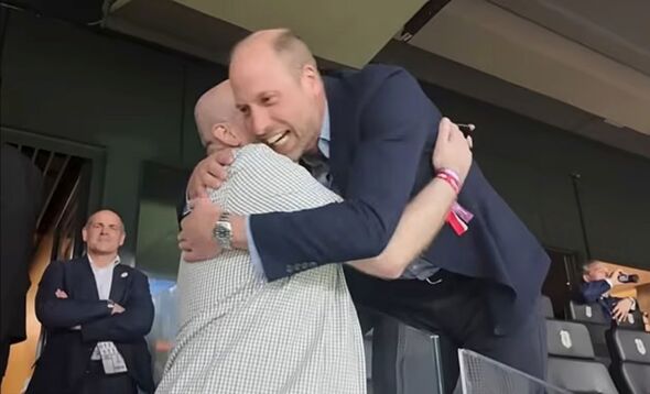 Prince William threw his arms around fellow fans