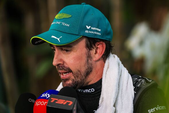 Fernando Alonso speaks to the press