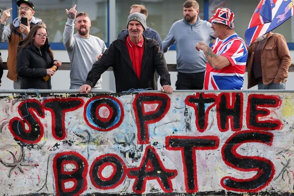 People demonstrate against small boat migrants outside The Falkirk Migrant Hotel