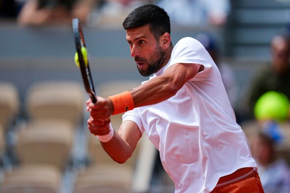 Novak Djokovic hits a backhand