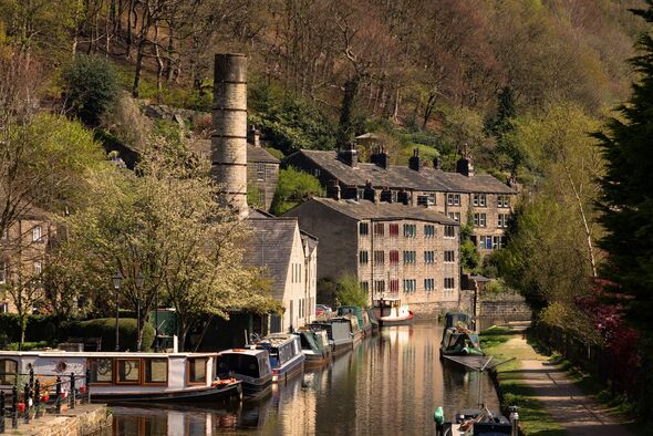 Hebden Bridge tow path with terrace houses overlooking canal