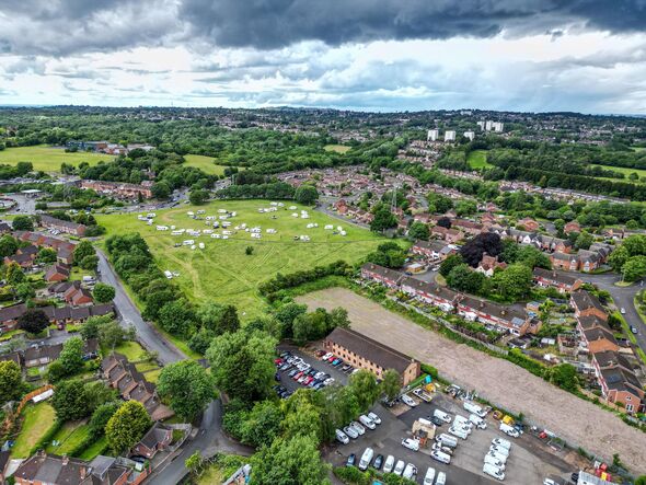 Group of travellers set up illegal camp of 40 caravans on parkland