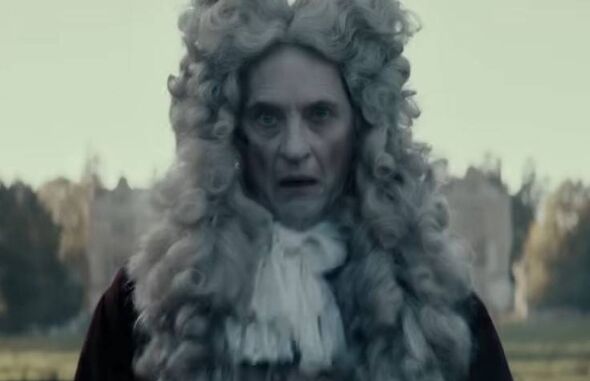 Richard E Grant wearing a wig in Savage House