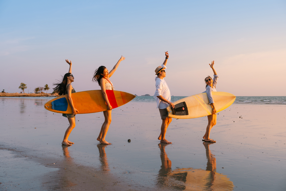 group of four holiday surf boards cheering